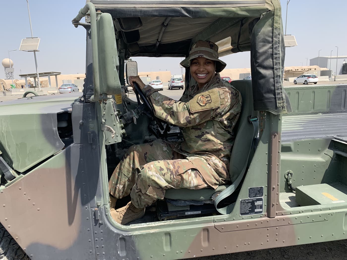 Alexis Diaz deployed, in uniform, at the wheel of a Humvee.