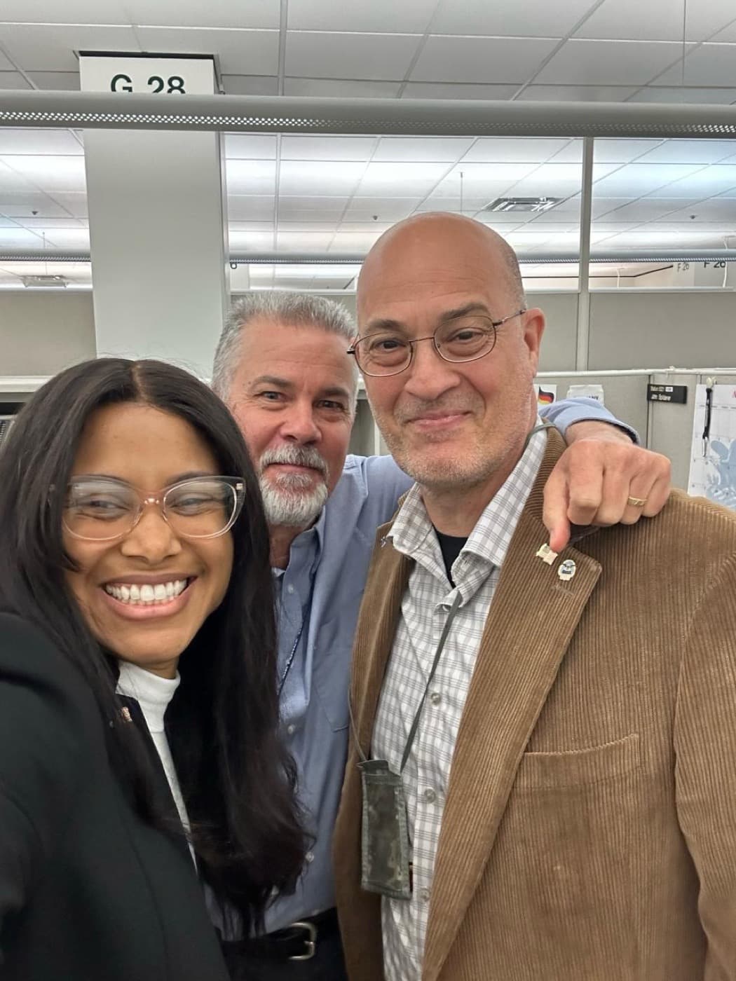Alexis Diaz with two DLA Troop Support colleagues at the office.